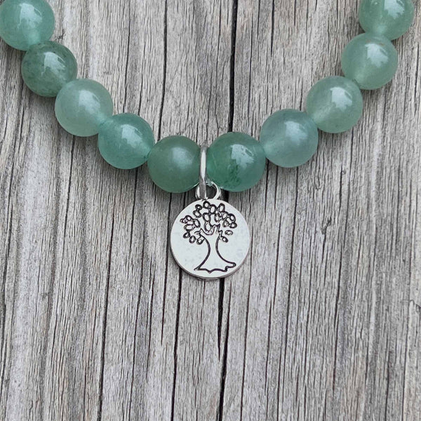 green aventurine bracelet with tree symbol
